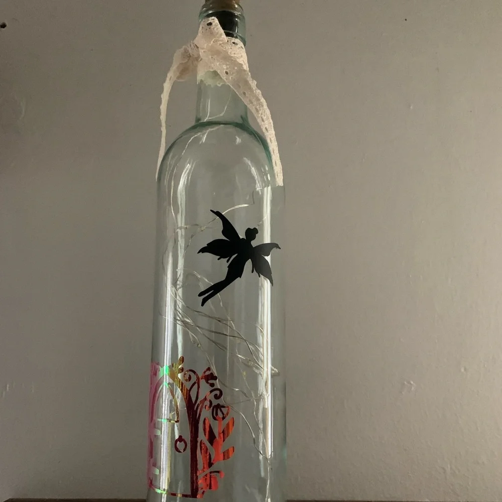 Fairy door lighted wine bottle